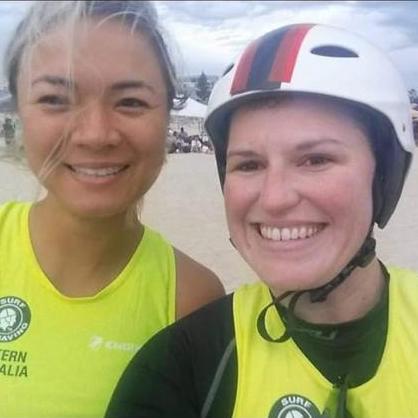 Kat and Nicole in rowing uniform smile at the screen