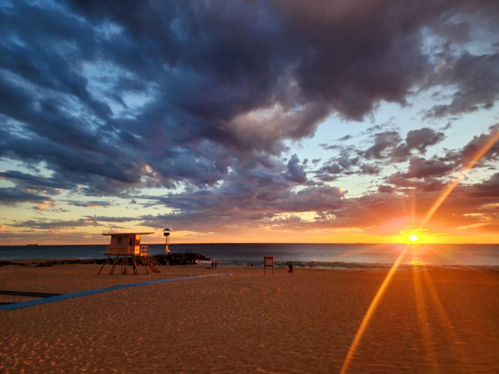 Photo of the beach at dawn.